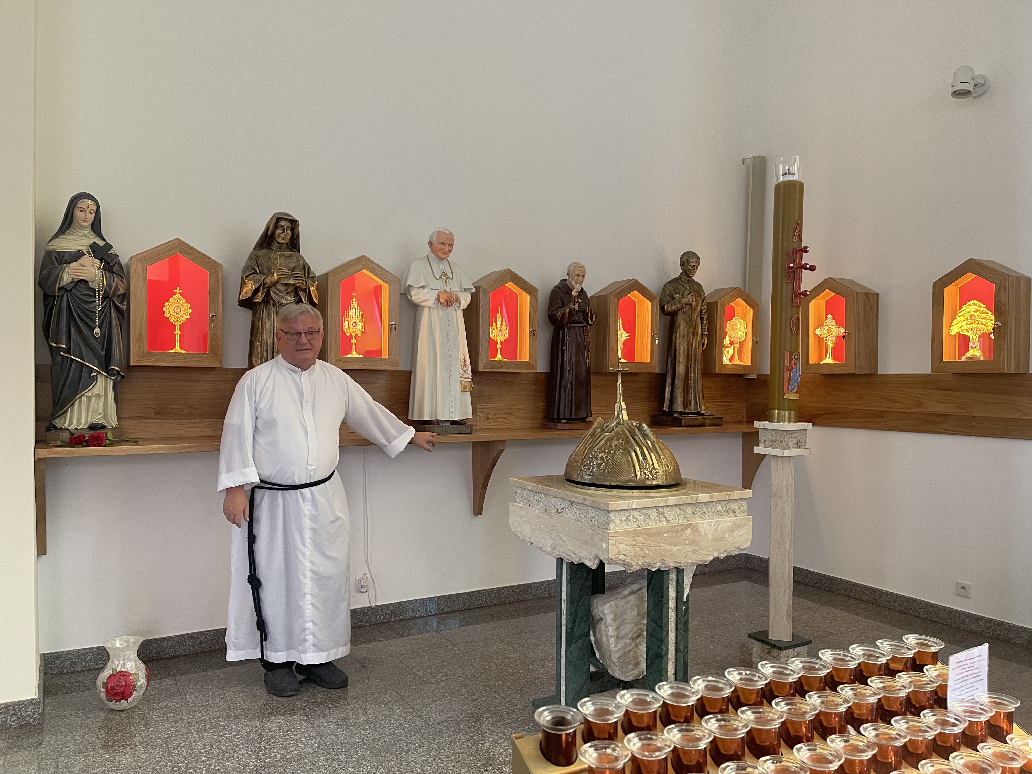 Father Chris veiwing the Relics